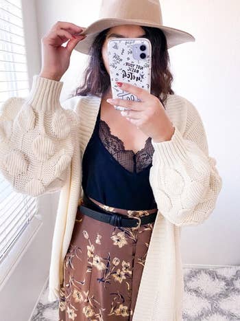 front view of a different reviewer wearing the cardigan in cream