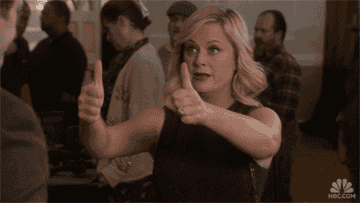 Leslie Knope giving two big thumbs up