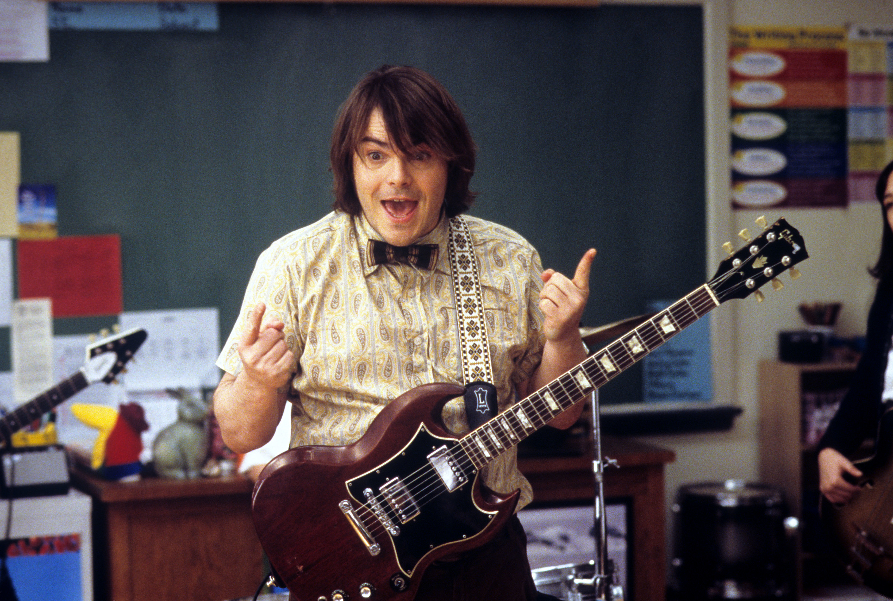 Jack Black playing a guitar in a classroom in &quot;School of Rock&quot;