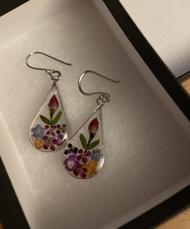 tear drop earrings with flowers inside of them