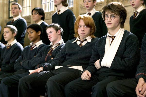 Rupert Grint sits next to Daniel Radcliffe in Harry Potter and the Goblet of Fire