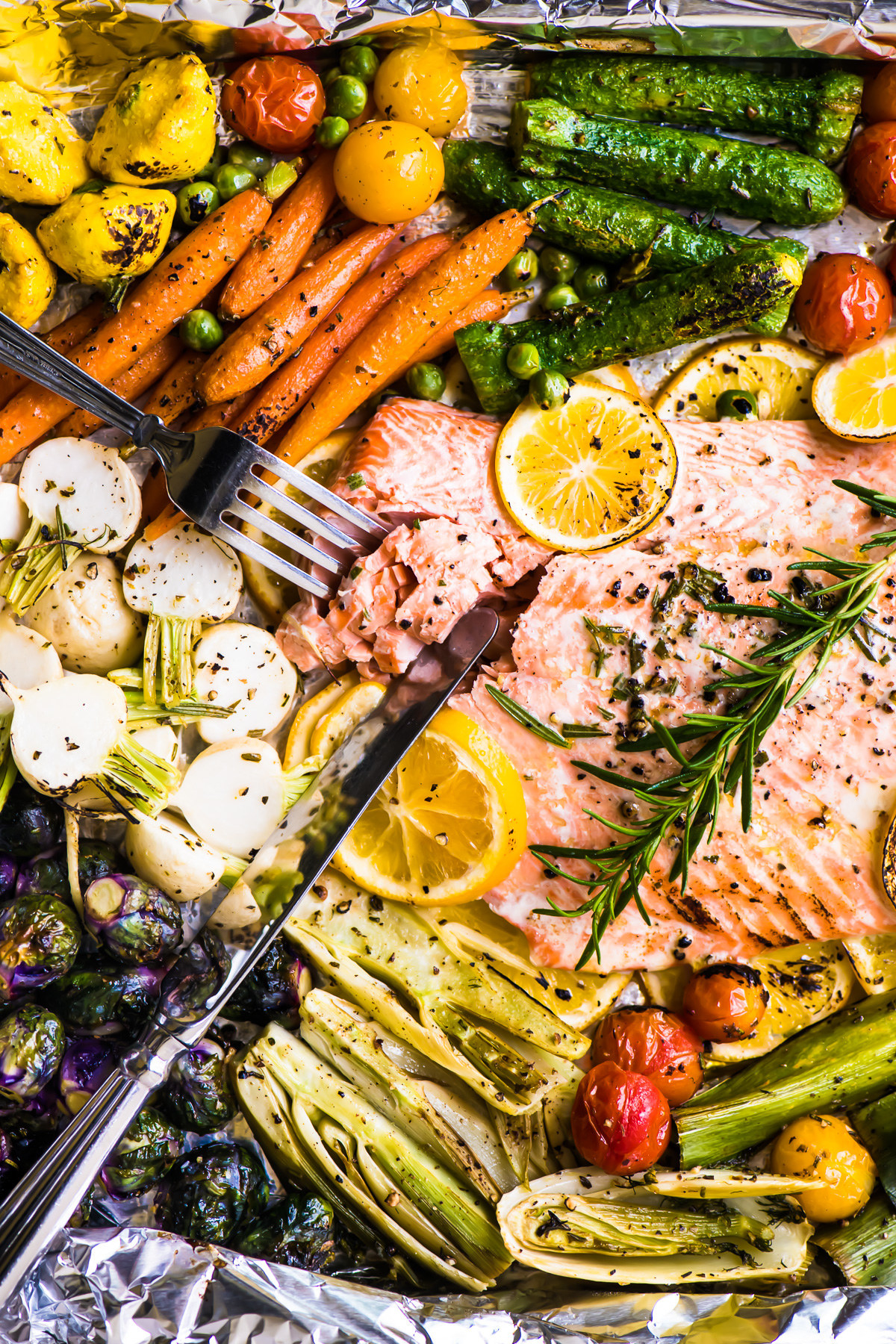 Sheet pan salmon with lots of colorful vegetables.