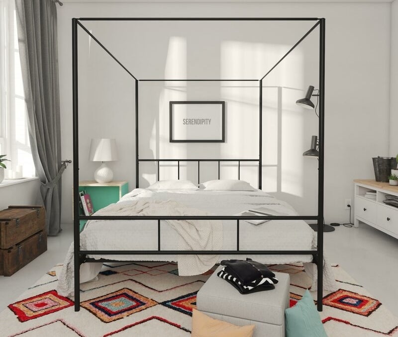 Black metal canopy bed with headboard and footboard