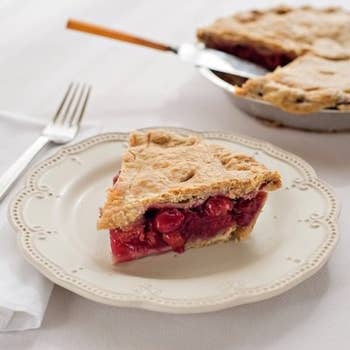 A slice of the old mission cherry pie next to the rest of the pie