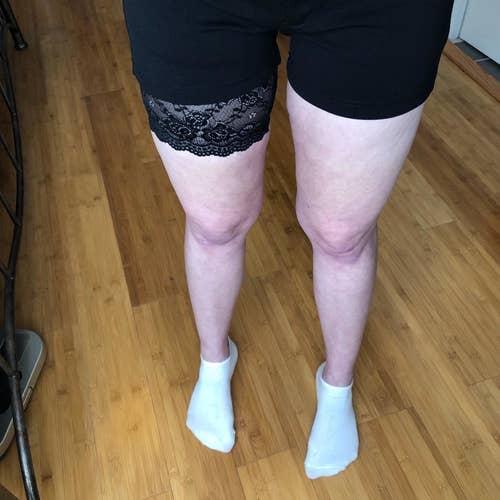 reviewer wears black anti-chafing lace bands with running compression shorts