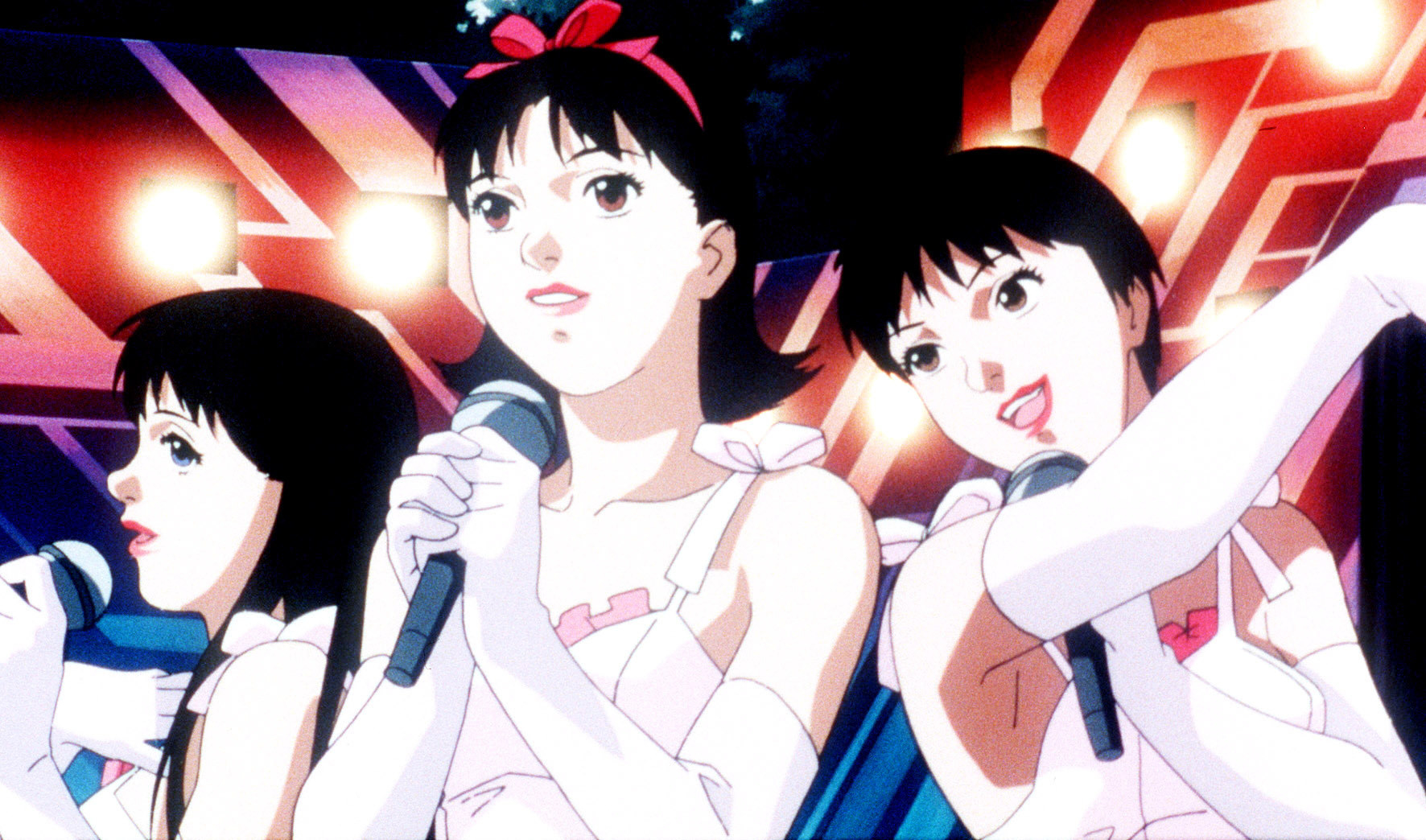 three cartoon women singing and holding microphones
