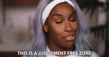 jackie aina saying this is a judgment free zone while doing her makeup for a video