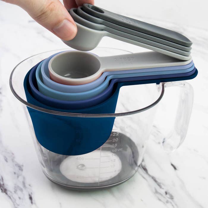 The set, which has measuring cups and spoons that stack together