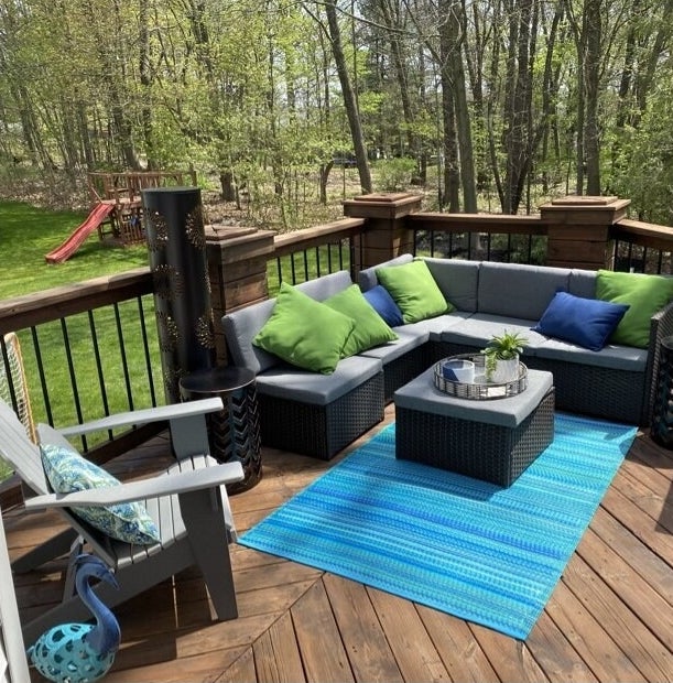 a reviewer&#x27;s patio with the outdoor seating and table