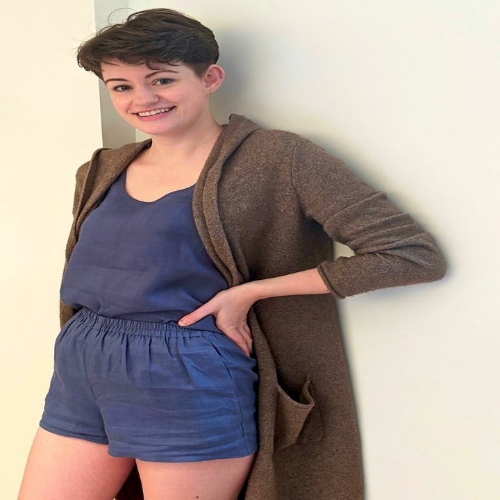 someone wearing the tank and short set with a brown cardigan 