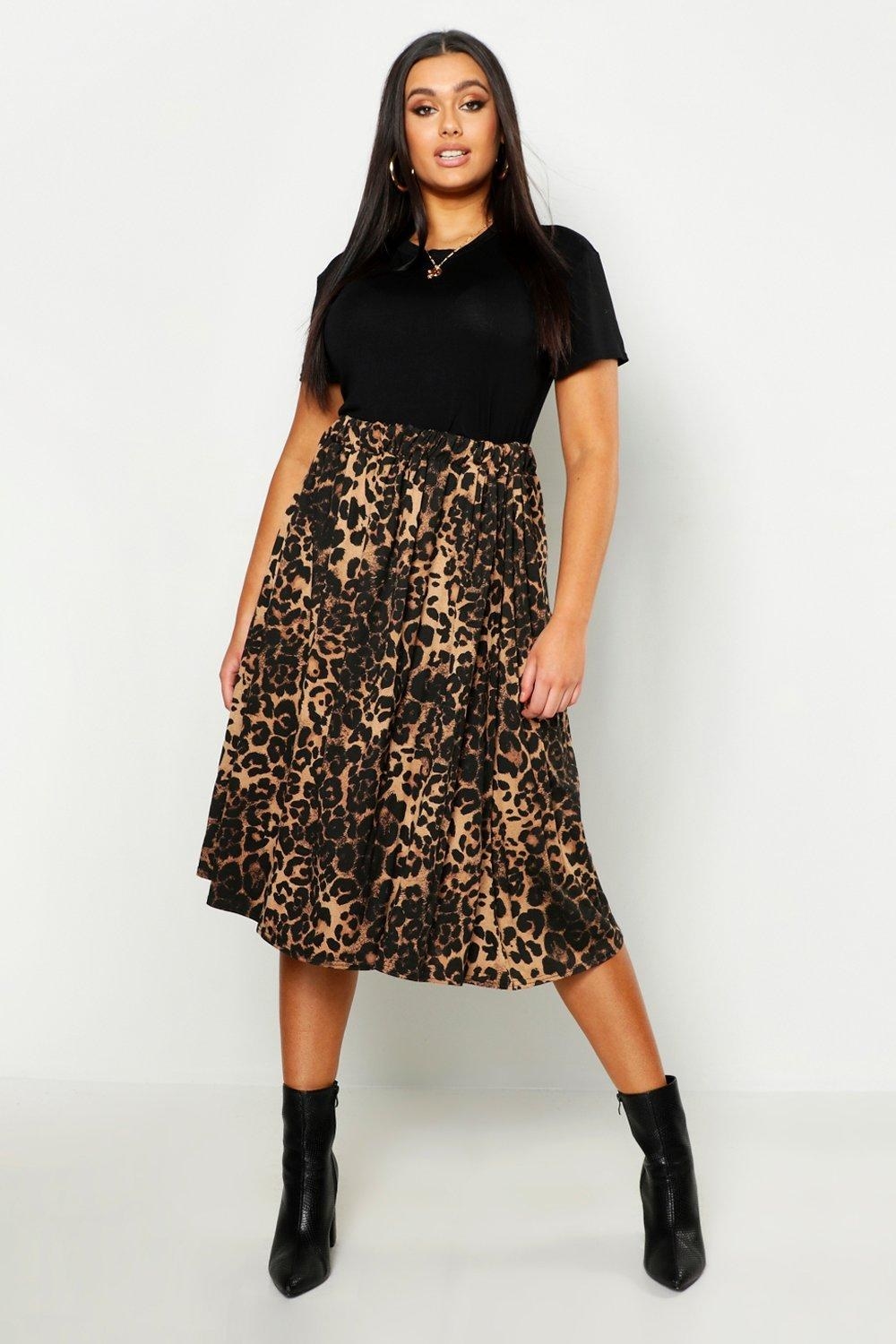 Model wearing the midi brown leopard print skirt