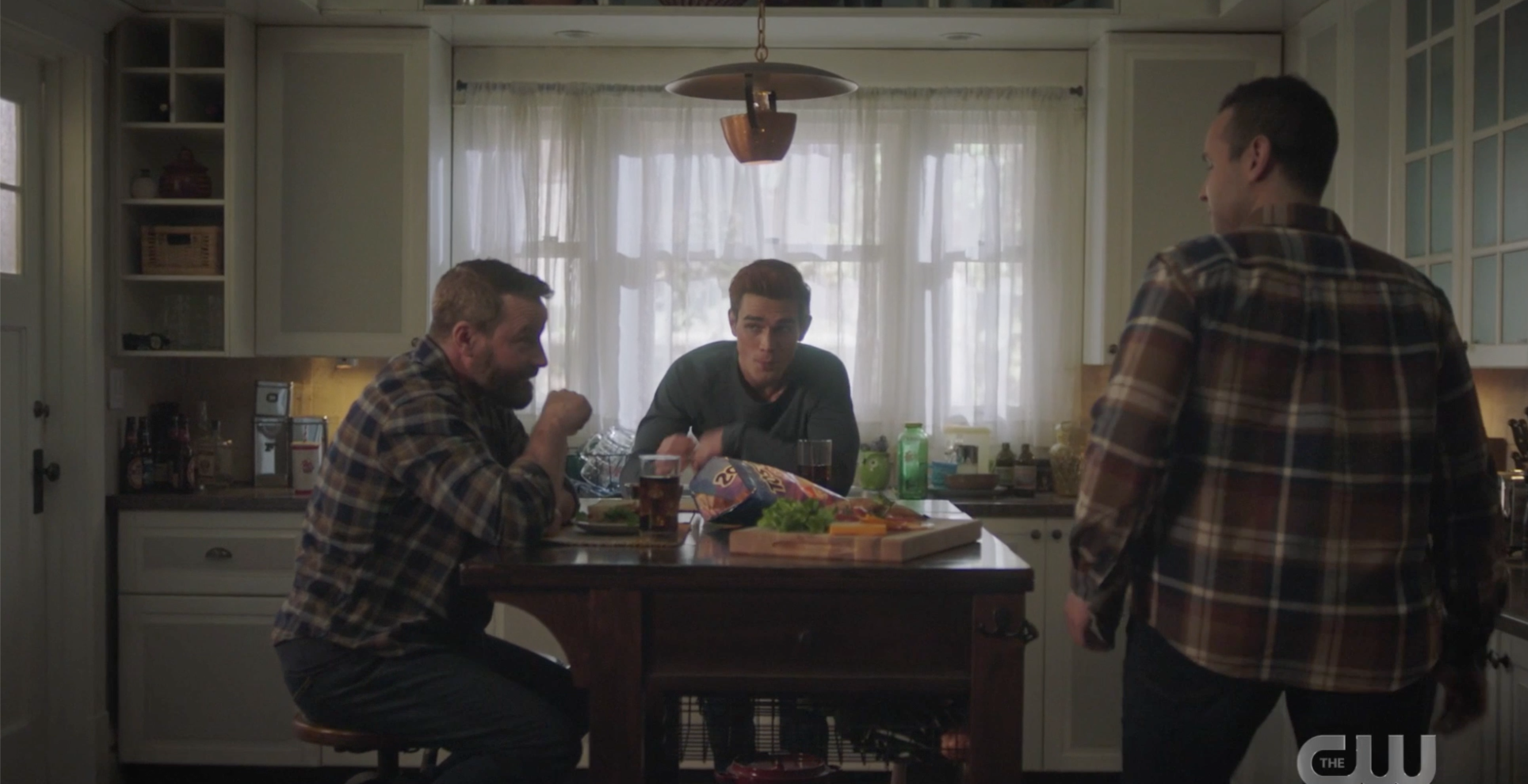 Archie, Frank, and Eric in the kitchen with Tostitos chips