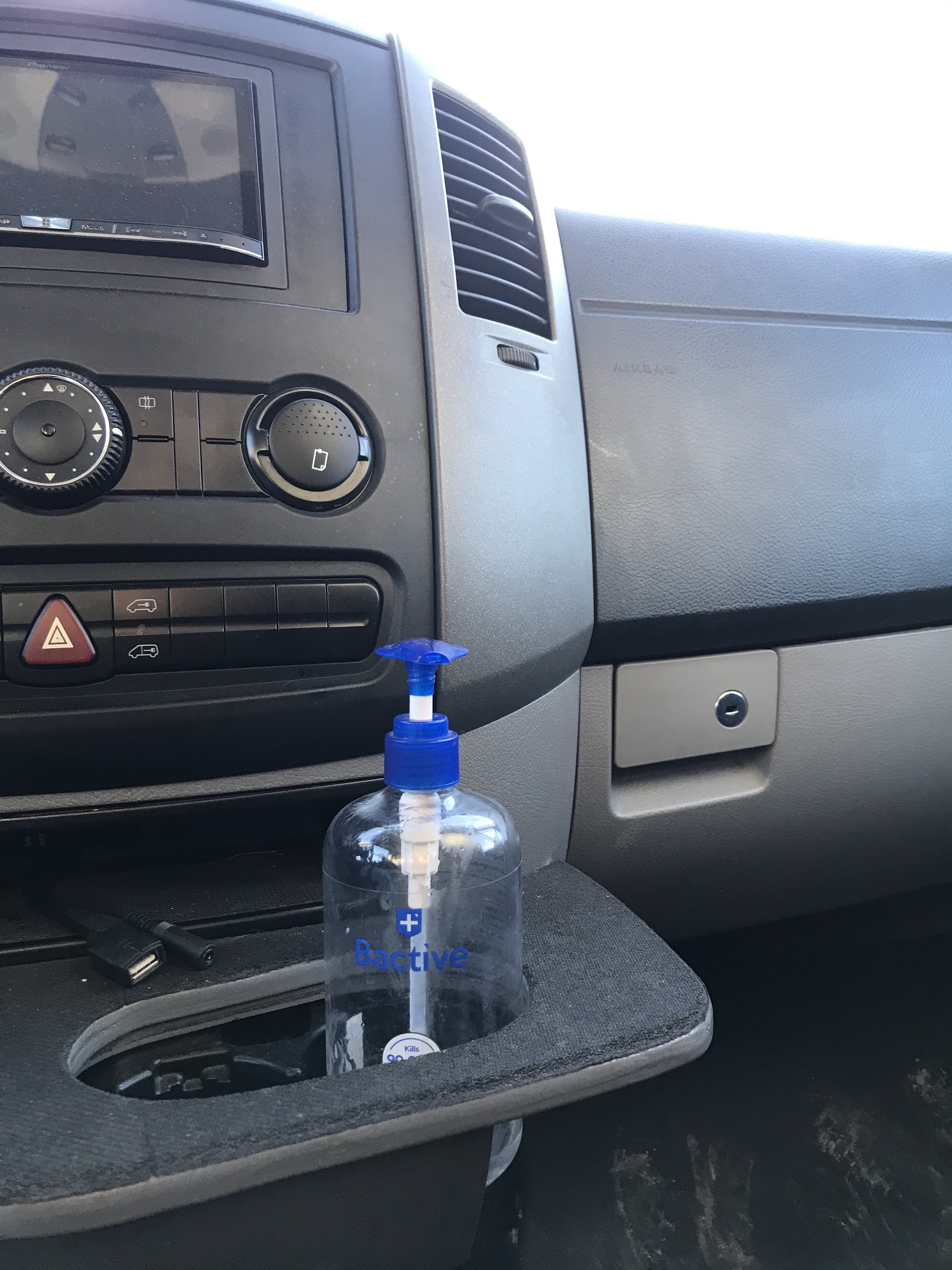 Van console with hand sanitizer