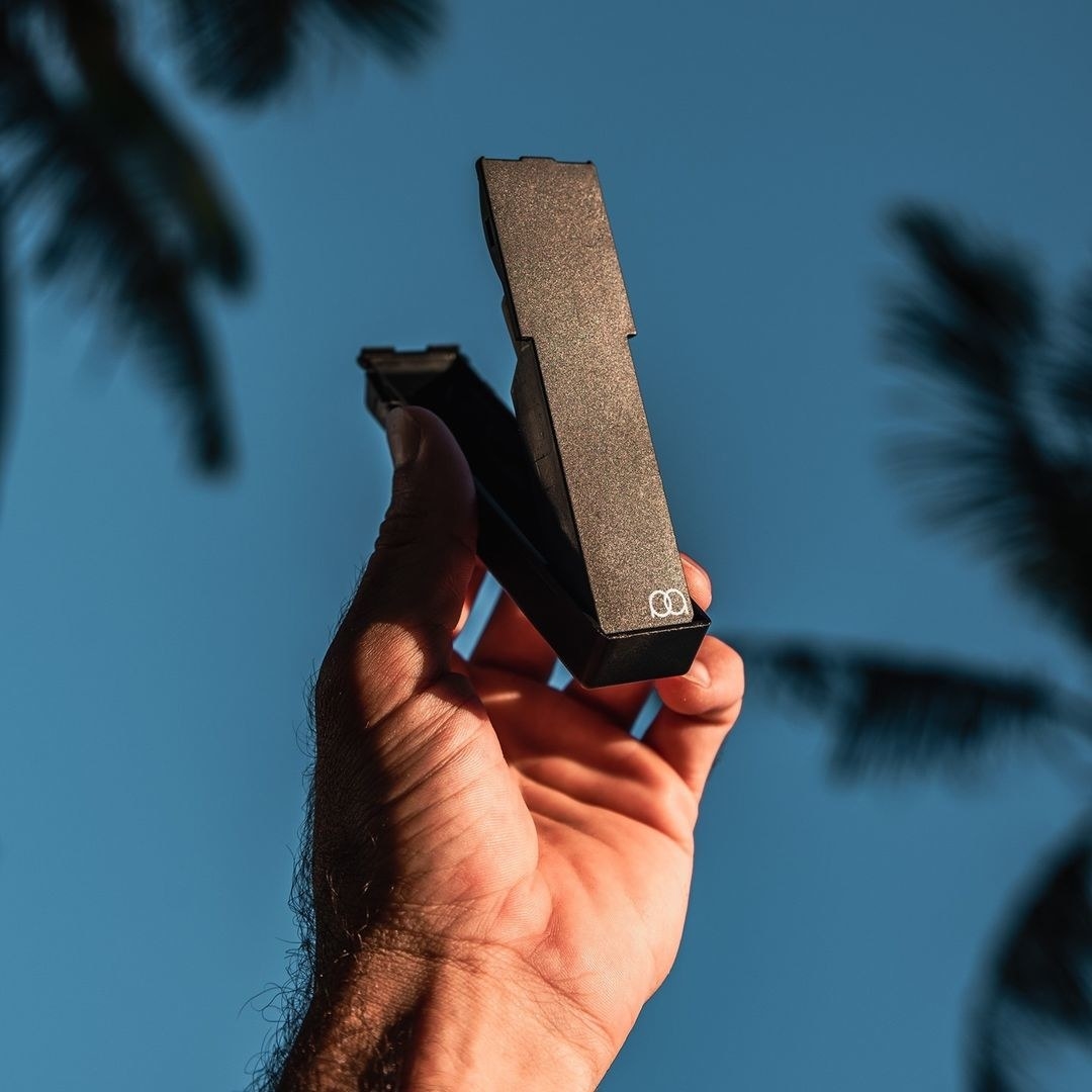 A person holding the case up to the sky