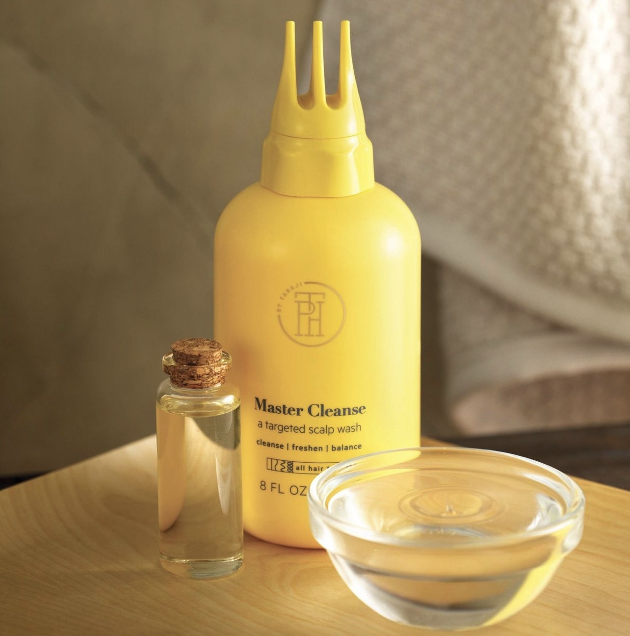 A yellow bottle of hair treatment