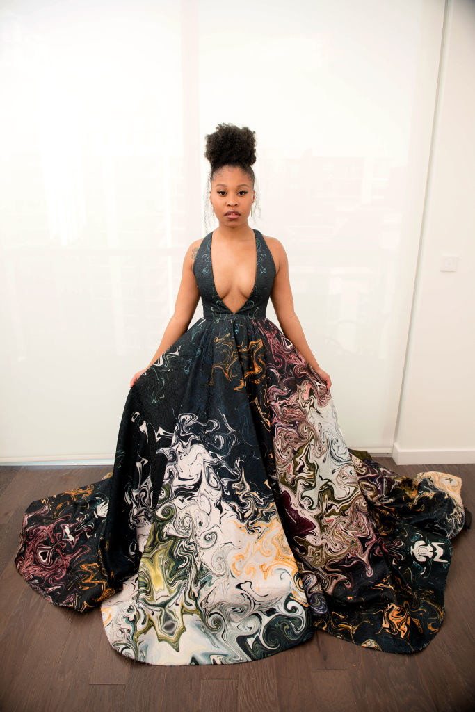 Dominique wearing a halter-top, multicolored wide gown