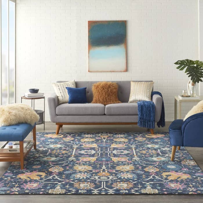 The blue area rug with a floral pattern