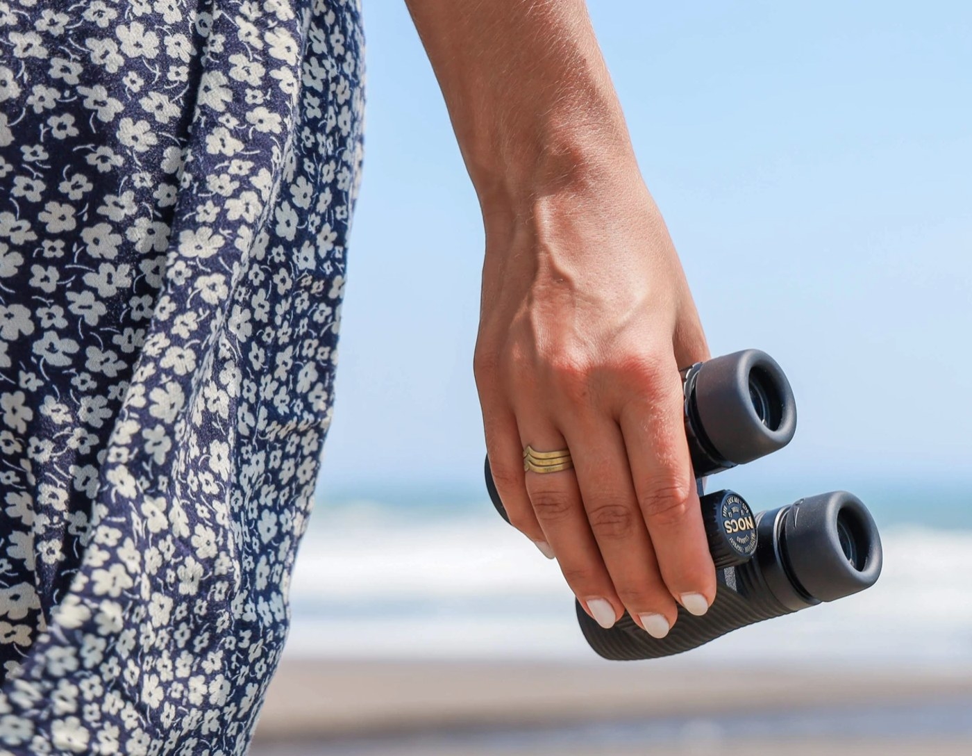 Women holding binoculars.