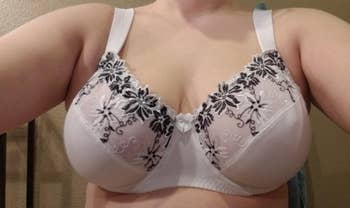 A reviewer wearing the bra in light pink