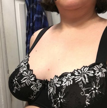 A reviewer wearing the bra in black 