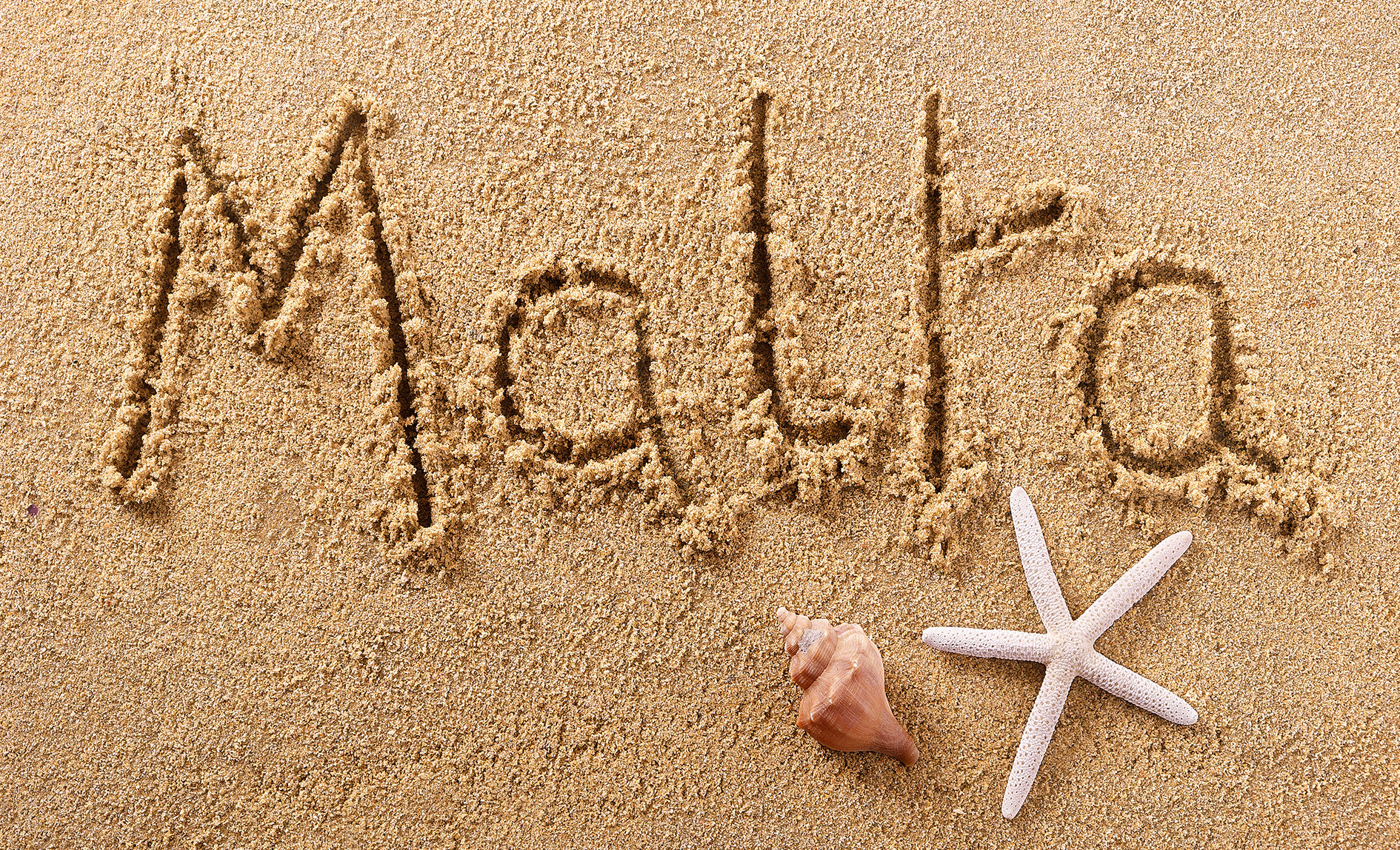 &quot;malta&quot; written in the sand