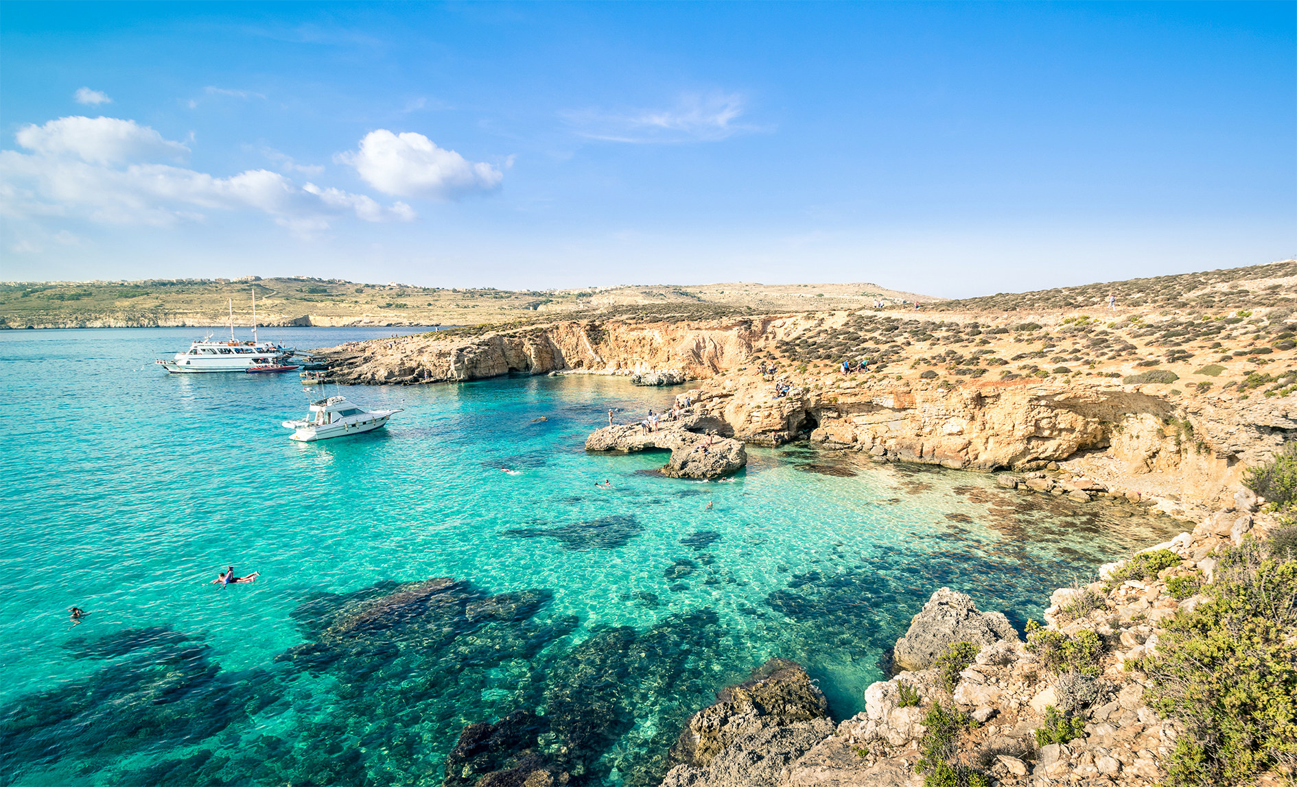 wide shot of the blue lagoon and surrounding rocks