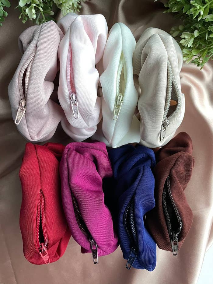 Eight zip-up scrunchies in a variety of colours 