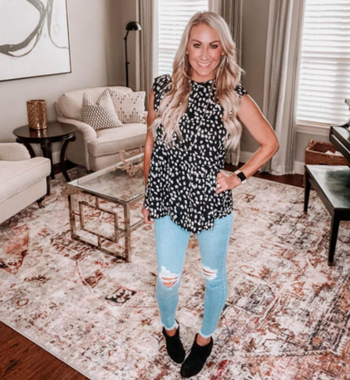 A customer review photo of them in the blouse in the Black color