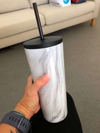 marble printed tumbler cup with a black straw