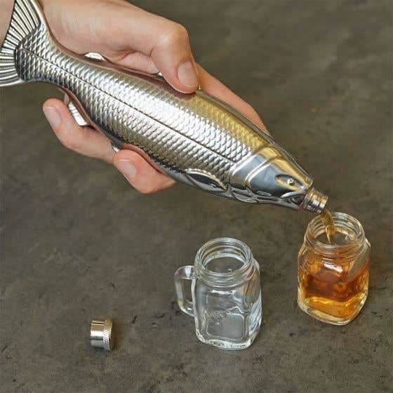 person pouring out liquid from the fisk flask