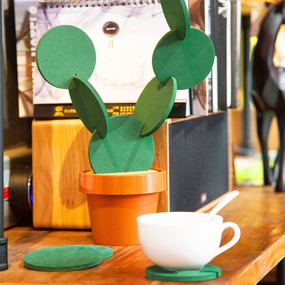 the coasters in their plant form and one under a cup