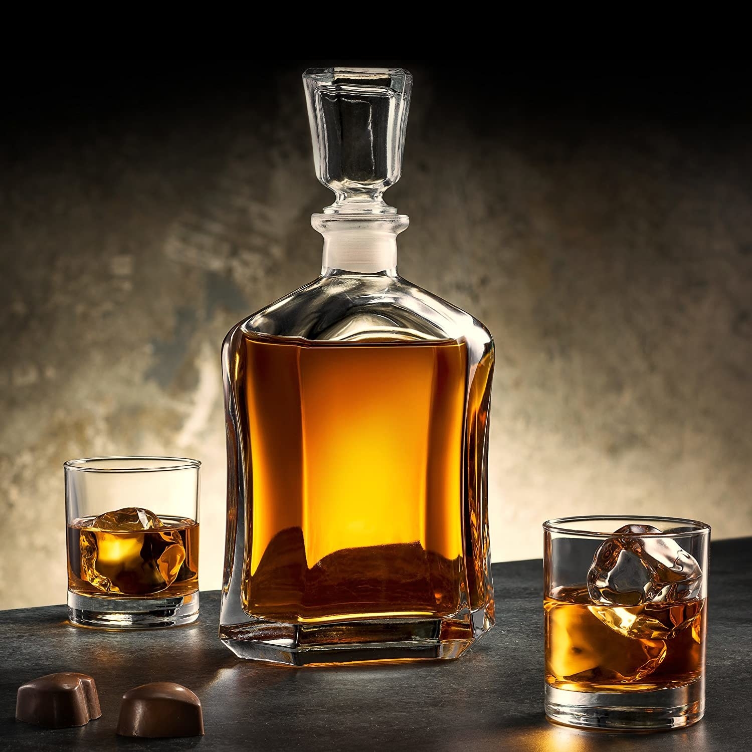 glass faceted bottle decanter full of whiskey, with faceted glass topper