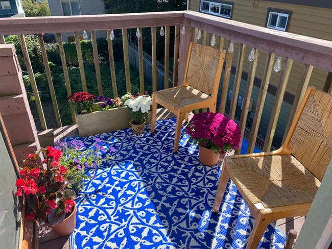 blue and white patterned rug on reviewer's balcony