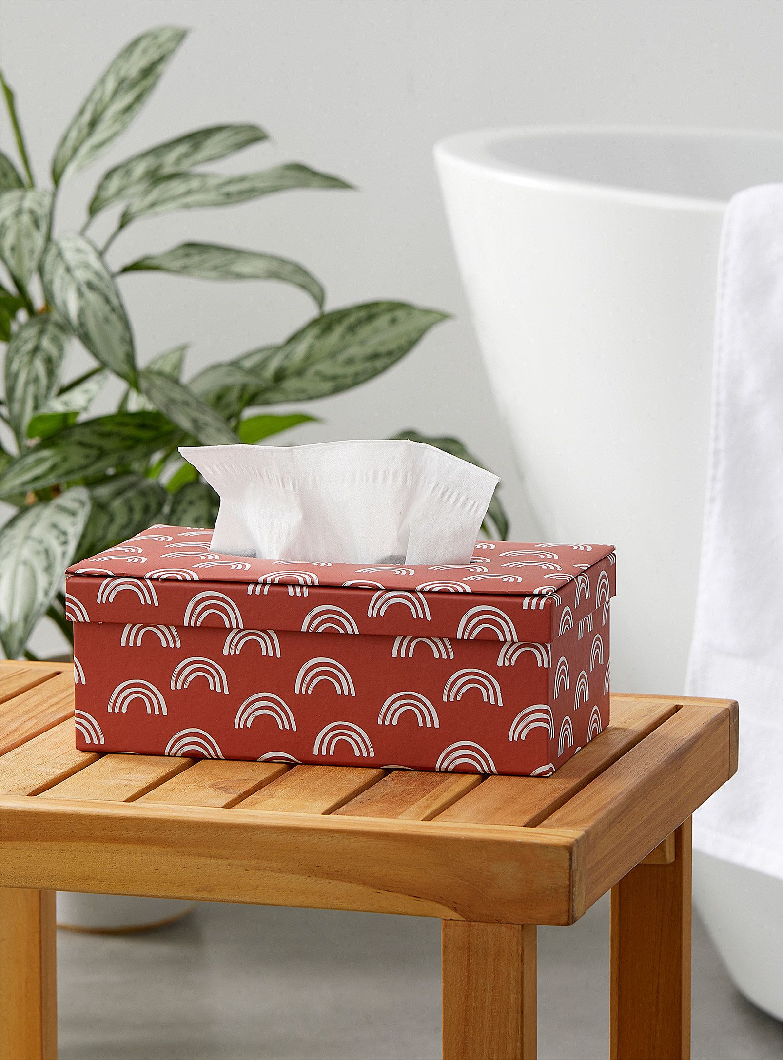 A tissue box on a wooden stool