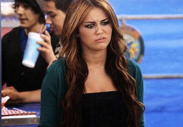 Miley Cyrus makes a disgusted expression in an episode of Hannah Montana