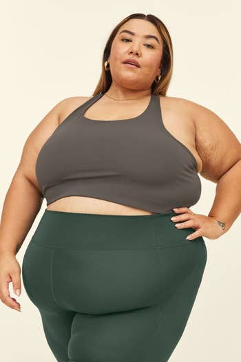 model wearing the sports bra in dark grey