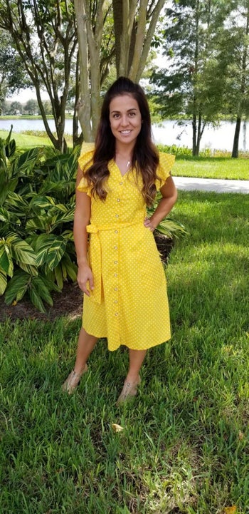 Reviewer wearing yellow polka dot dress