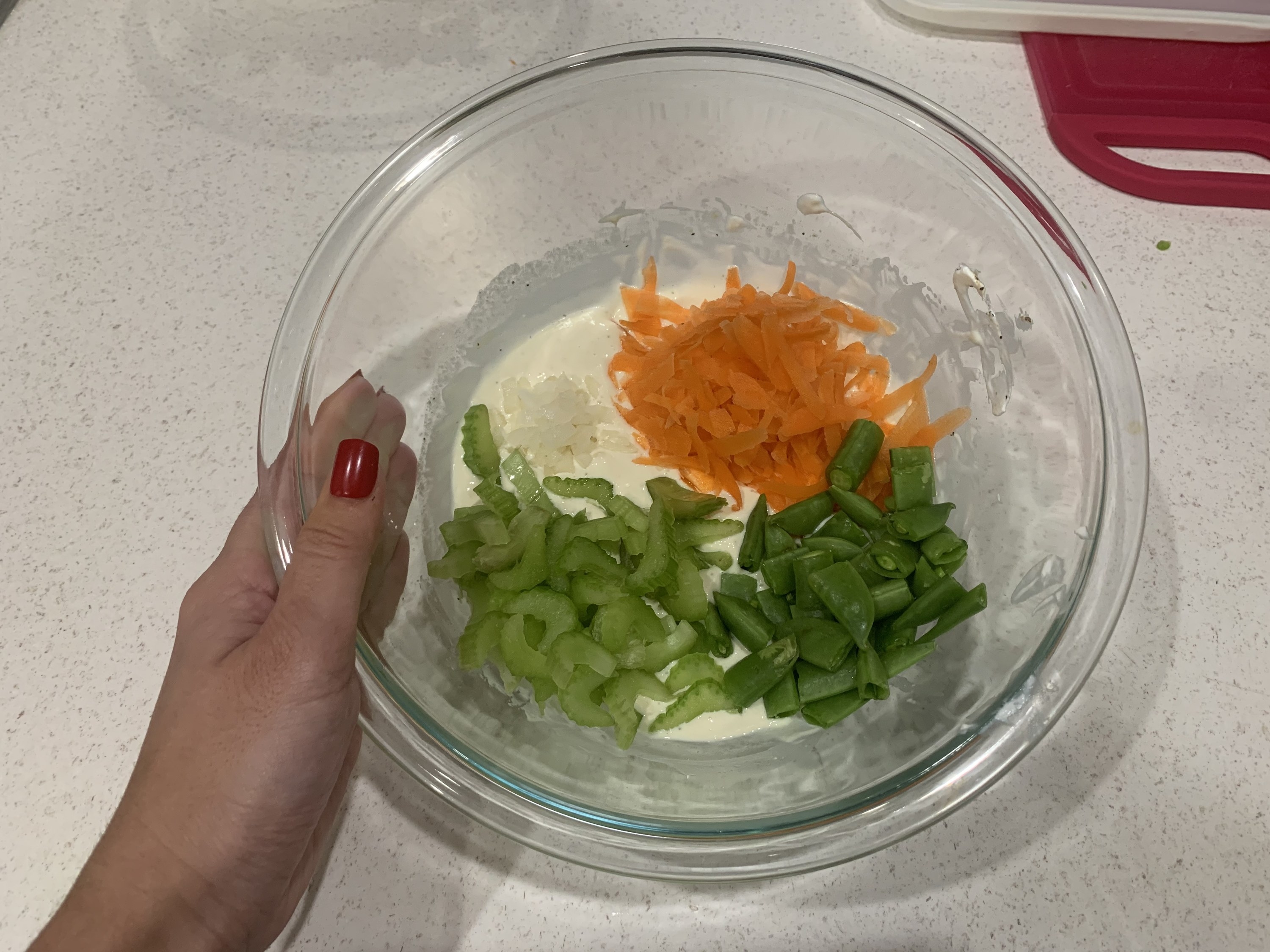 Bowl of dressing and veggies on top