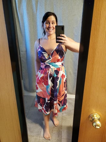 Reviewer wearing OUGES V-neck party dress