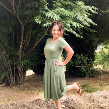 Reviewer wearing army green short-sleeve dress