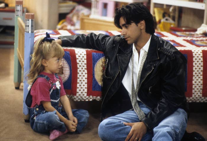 John and one of the Olsen twins on the &quot;Full House&quot; set 