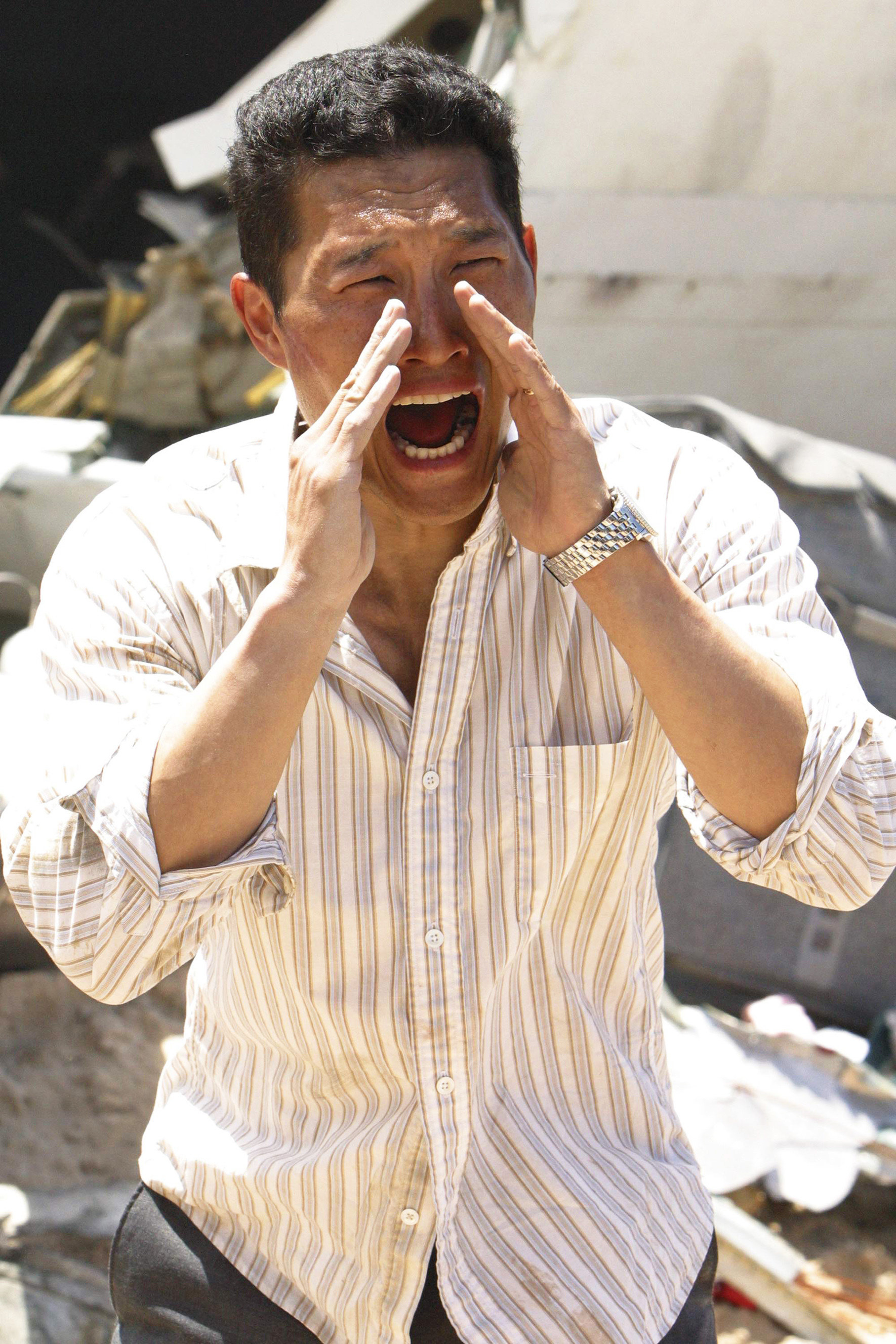 Kim yells with his hands over his hands in the TV show Lost