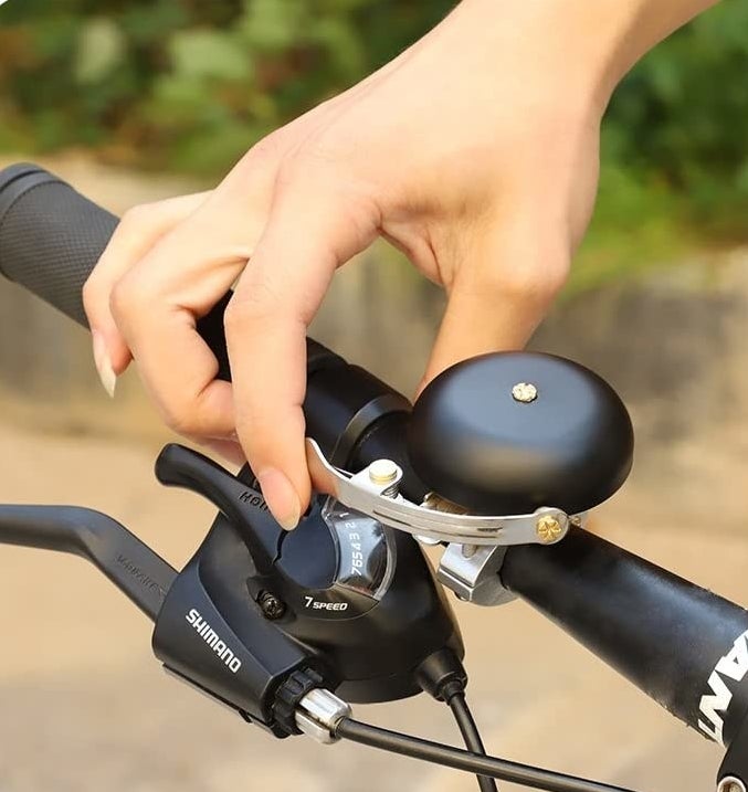 A person about to ring their bike bell 