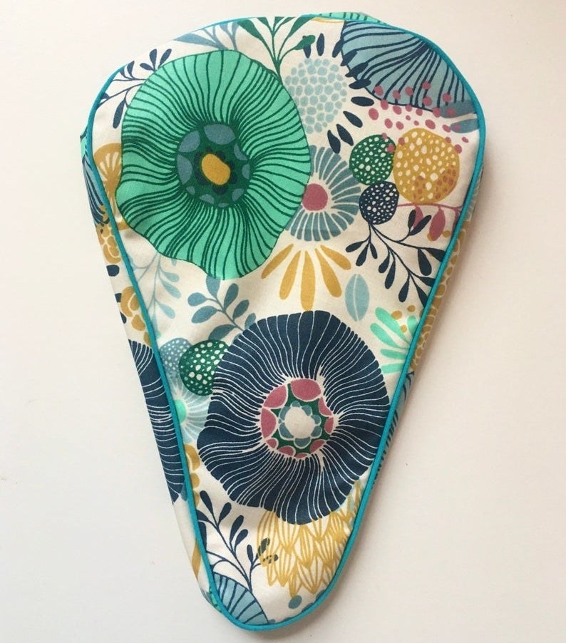 A floral patterned bike seat cover 
