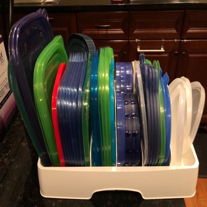 reviewer showing the lid organizer from the side