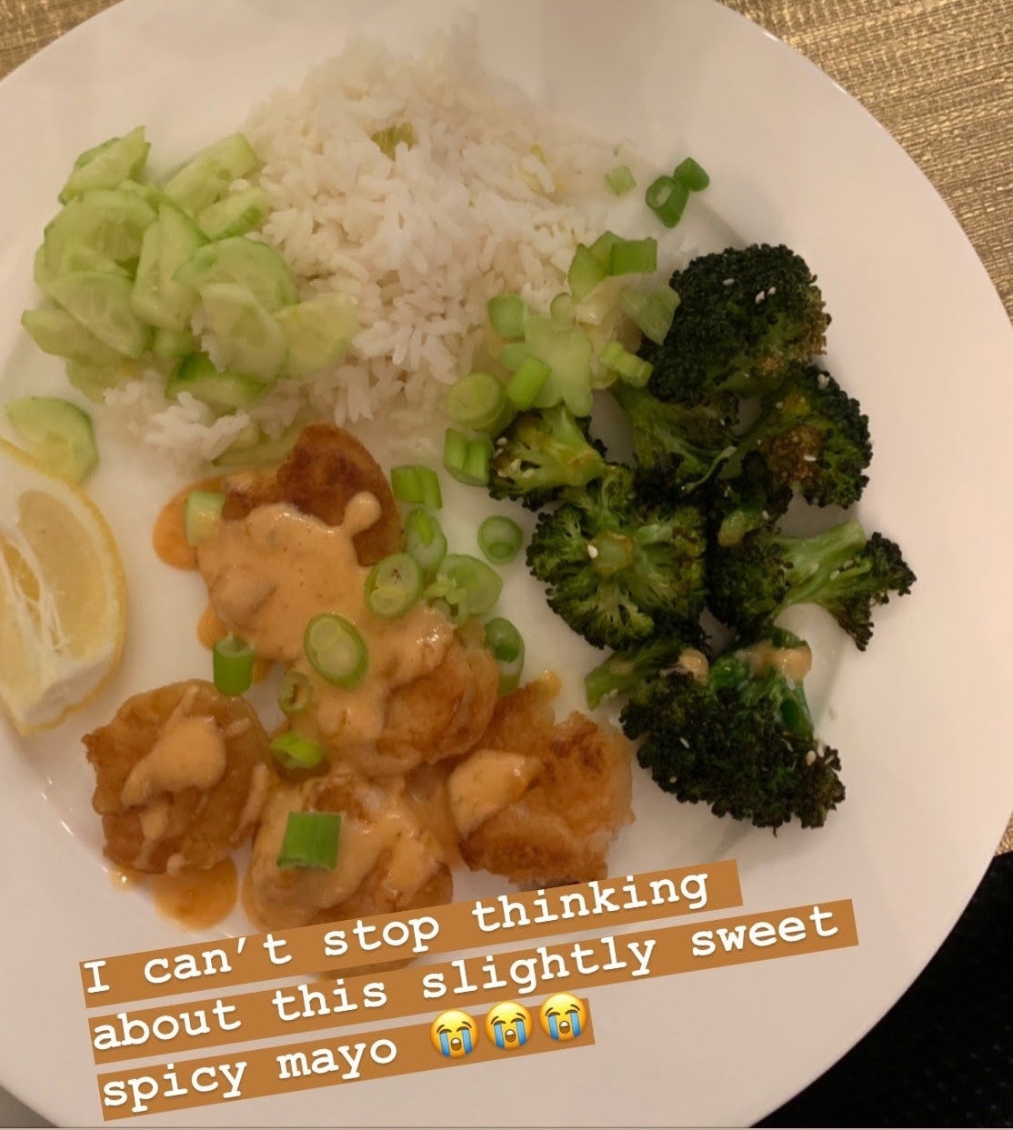 buzzfeed editor&#x27;s plate of broccoli, rice, and shrimp with sauce captioned &quot;I can&#x27;t stop thinking about this slightly sweet spicy mayo&quot;