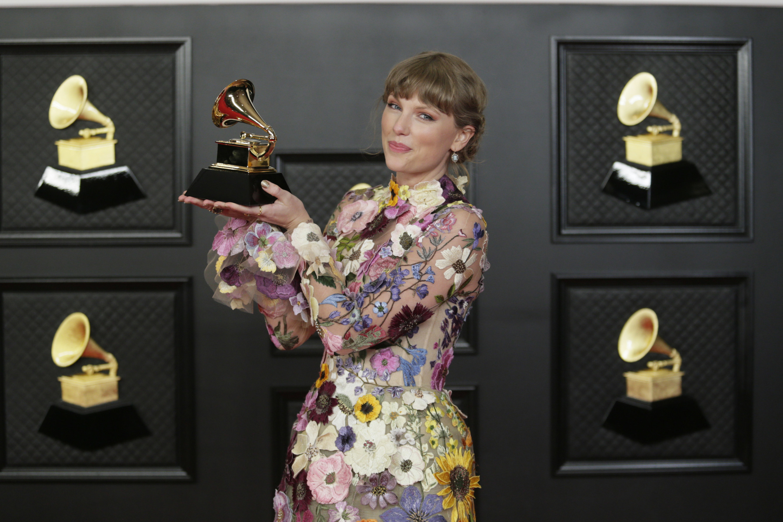 Holding up a Grammy