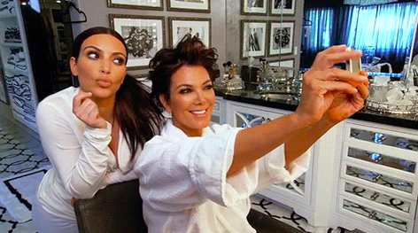 Kris Jenner taking a selfie with Kim Kardashian