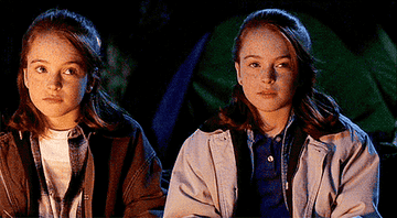Lindsay Lohan and her twin self exchange a glance in &quot;The Parent Trap&quot;