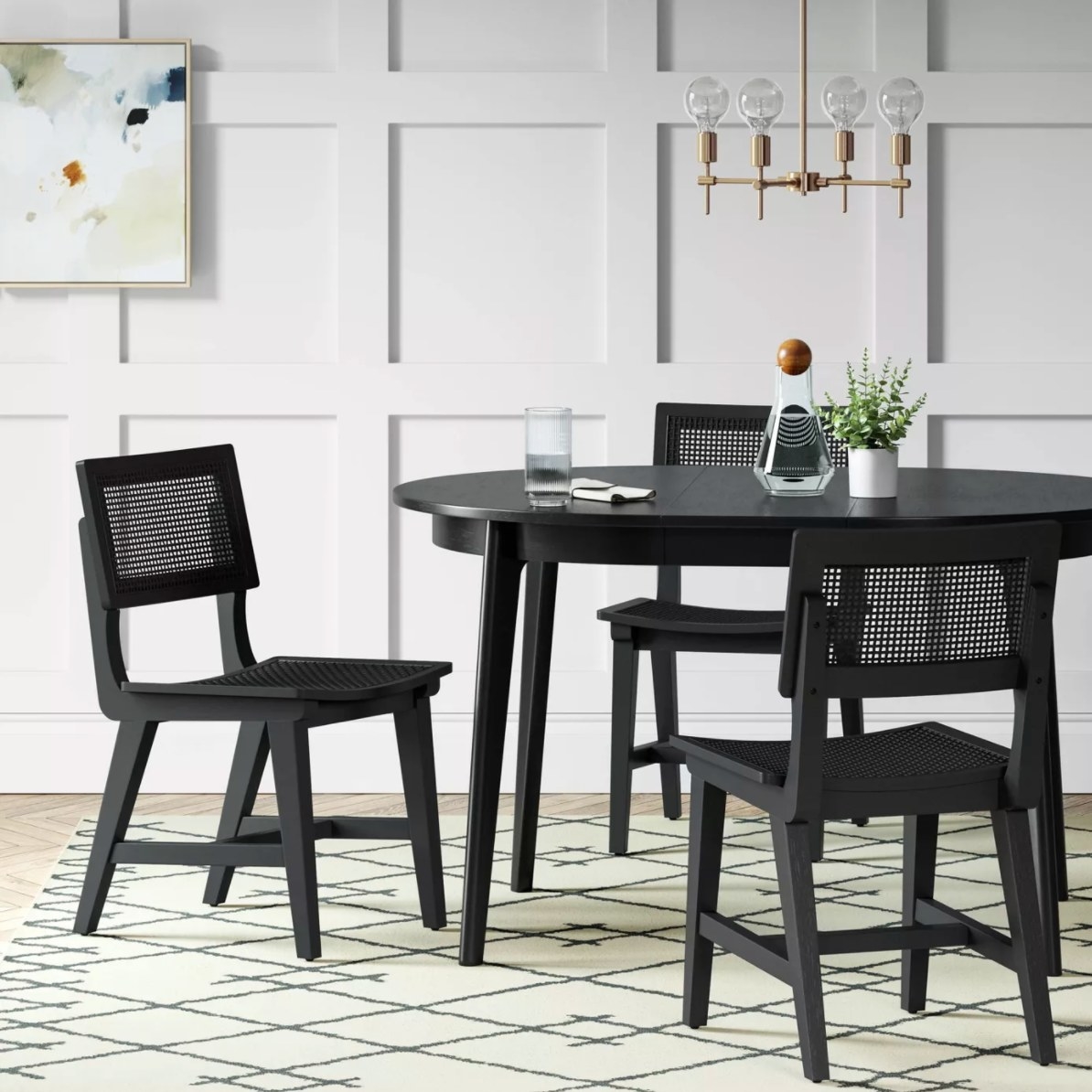 The midcentury round extendable dining table in black